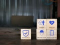 Safety at work concept with icons on wooden cubes. Royalty Free Stock Photo