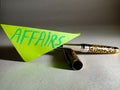 affairs text displayed on green colour paper slip pen pen isolated Royalty Free Stock Photo