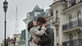 Happy couple kissing on urban street. Young lovers enjoying date outdoor. Royalty Free Stock Photo