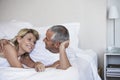 Affectionate Couple Relaxing On Bed Royalty Free Stock Photo