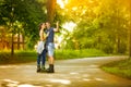 Affectionate couple on rollerblades Royalty Free Stock Photo