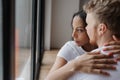 Affectionate lovely multiracial couple embracing with fondness