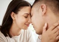 Affectionate, loving and happy couple faces together and relaxing at home enjoying quality time. Loving and romantic