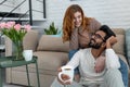 Married couple drinking coffeee, enjoying spending time together, relaxing, sweet tender moment.