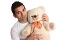 Affectionate man holding bear Royalty Free Stock Photo