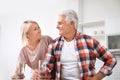 Affectionate senior couple with glasses of water Royalty Free Stock Photo