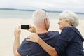 affectionate senior couple on tropical beach holiday Royalty Free Stock Photo