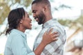 Affectionate young African couple standing together outside Royalty Free Stock Photo