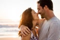 Affectionate young couple hugging on a beach at sunset Royalty Free Stock Photo