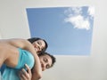 Affectionate Young Couple Under Skylight Royalty Free Stock Photo