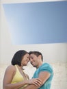 Affectionate Young Couple Under Skylight Royalty Free Stock Photo