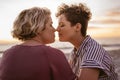 Affectionate young lesbian couple enjoying a romantic beach sunset together Royalty Free Stock Photo