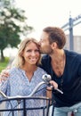 Affectionate young man kissing his girlfriend