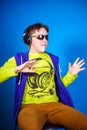 Affective teenage boy listening music in headphones Royalty Free Stock Photo