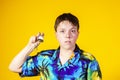 Affective teenage boy with watch showing time Royalty Free Stock Photo