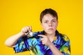 Affective teenage boy with watch showing time Royalty Free Stock Photo