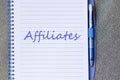 Affiliates write on notebook Royalty Free Stock Photo