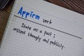 Affirm verb write on a book isolated on Wooden Table