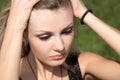 Afflicted girl keeps hands for a head Royalty Free Stock Photo