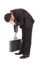 Afflictive businessman stoop and hold his head