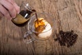 Affogato, pouring espresso coffee to Vanilla ice cream in double Royalty Free Stock Photo