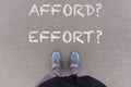 Afford or Effort text on asphalt ground, feet and shoes on floor