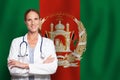 Afgan general practitioner doctor gp on the flag of Afganistan Royalty Free Stock Photo