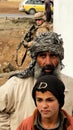 Afghan civilians and soldier Royalty Free Stock Photo