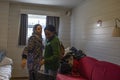 Afghan and Congolese refugee takes farewell in a refugee center.