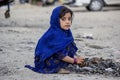 An afghan girl who collects all the rubber from workshops
