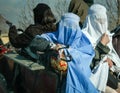 Women riding a pony and cart in Afghanistan