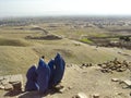 Afghan women in burqas on hilltop