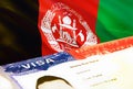 Afghanistan immigration document close up. Passport visa on Afghanistan flag. Afghanistan visitor visa in passport,3D rendering.