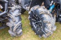 BRP Can-Am quad bikes at Mud Racing contest. Wheels close up. ATV SSV motobike competitions