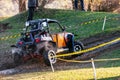 Sportsman drives buggy at Mud Racing contest. ATV SSV motobike competitions are popular