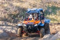 Sportsman drives buggy at Mud Racing contest. ATV SSV motobike competitions are popular