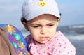 Afraid arab muslim baby girl on beach Royalty Free Stock Photo