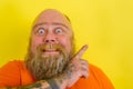 Afraid man with beard and tattoos is worried about something Royalty Free Stock Photo