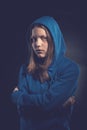 Afraid teen girl in hood