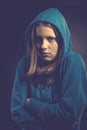 Afraid teen girl in hood