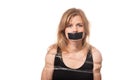 Afraid woman bound by tape and with mouth taped shut. Scared woman tied to chair become slave. Concept of forbidden opinion. male Royalty Free Stock Photo