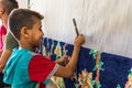 Student weavers at a carpet and tapestry weaving school