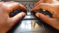 2 Africa Hands Typing on a Laptop`s Keypad