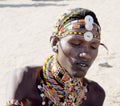 AFRICA, KENYA, MASAI MARA NATIONAL RESERVE, AUGUST 3, 2010: Masai village with masai tribe. Portait of masai warrior in the sun,