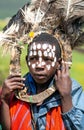 African children with ostrich feather headdress and painted of face