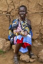 Portrait native Maasai tribe woman sells ornaments made of beads.