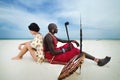 Africa. Kenya. Mombasa. Diani beach. January 28, 2012 Massai and white woman on the beach