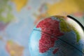 Africa map on a globe with earth map in the background. Royalty Free Stock Photo