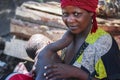 Africa, Tanzania, Zanzibar - February 2016: The woman feeds the child on the market