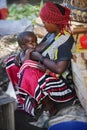 Africa, Tanzania, Zanzibar - February 2016: The woman feeds the child on the market